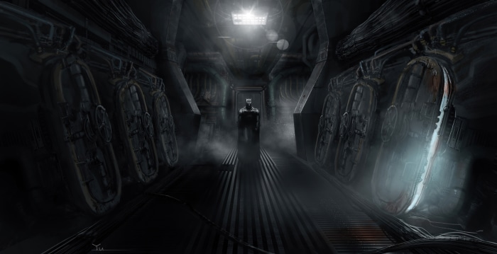 Batman in a dark, industrial hallway