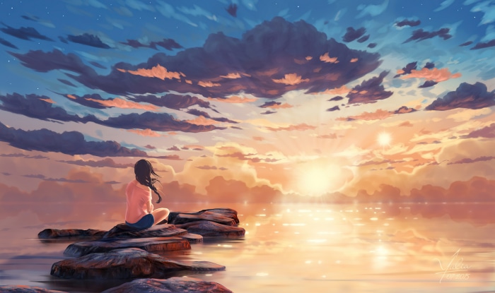 Girl sitting on rocks watching sunset over water