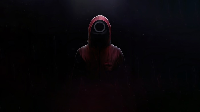 Squid Game character with circle mask in red hoodie