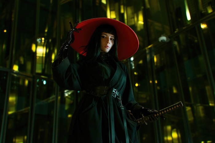 Woman in red hat with katana