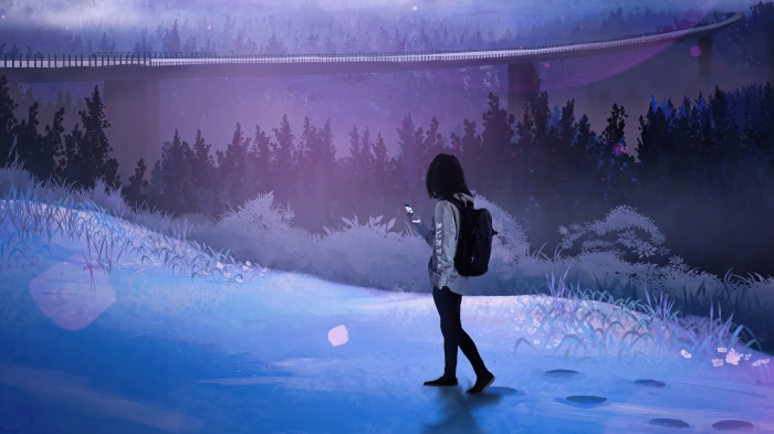 Girl with backpack looking at phone under a bridge