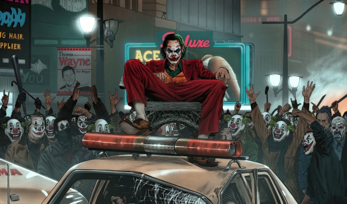 Joker sitting on a police car surrounded by clowns