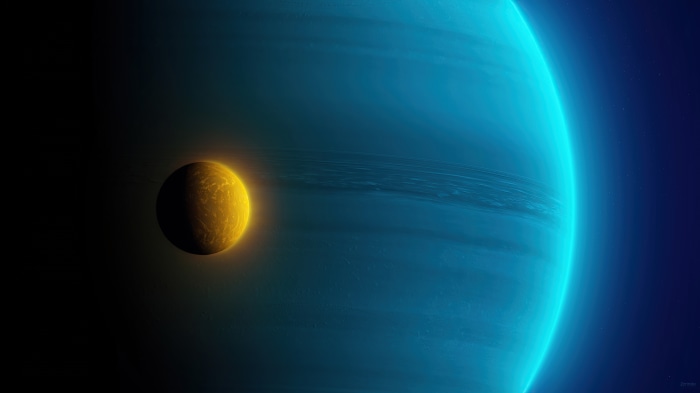 Yellow planet orbits a blue ringed planet