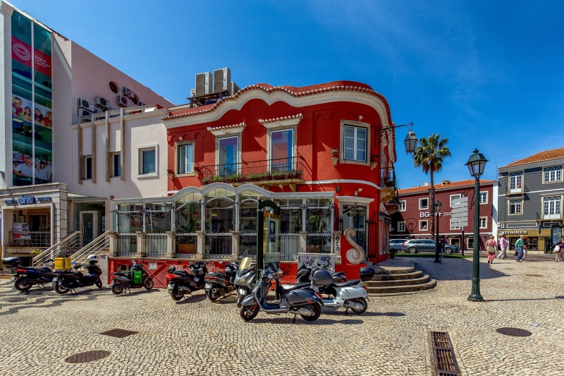 Scooters in a town square in Cascais, Portugal