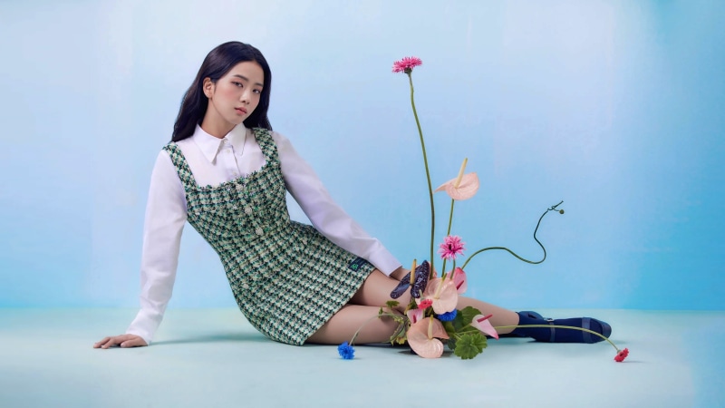 Asian woman in green dress with flowers