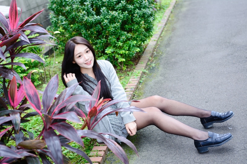 Asian Brunette Girl Sitting on Ground