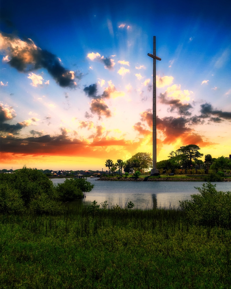 Cross at Sunrise over Water in St. Augustine, USA