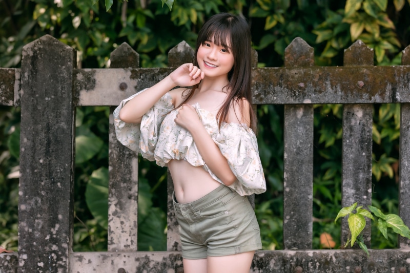 Asian girl in blouse and shorts
