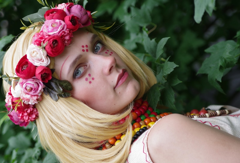 Blonde girl with flower wreath and makeup