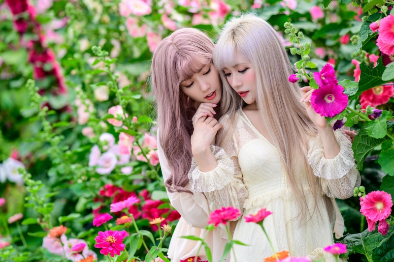 Two Asian women in a flower garden