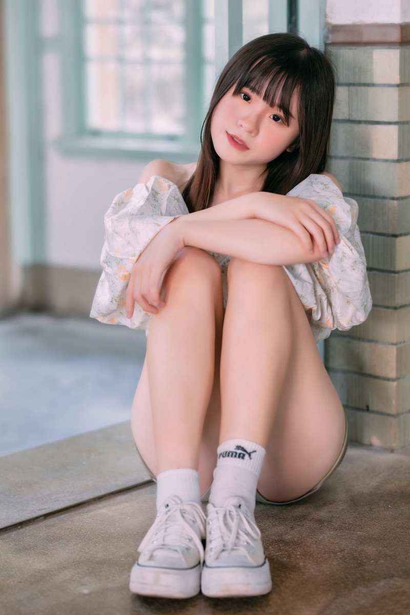 Asian girl sitting on the ground