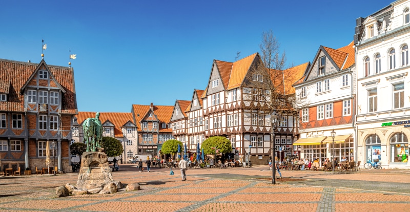 Town square with monument and half-timbered houses in Germany