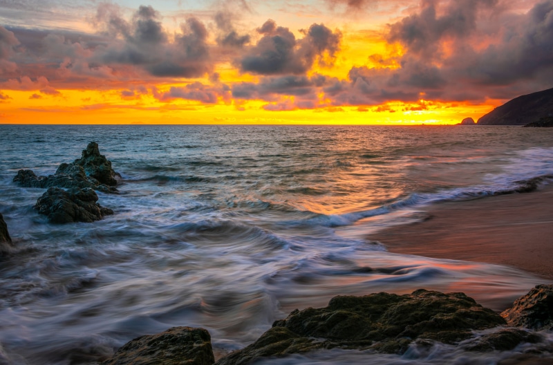 Sunset over the ocean coast in California