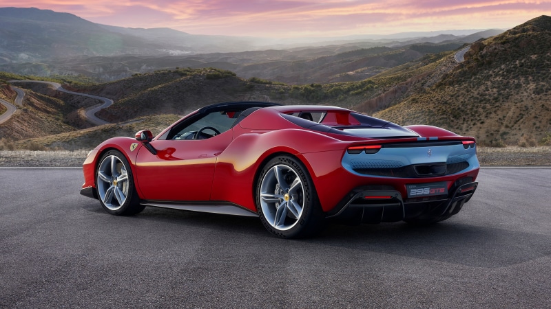Red Ferrari 296 GTS Roadster on a Mountain Road