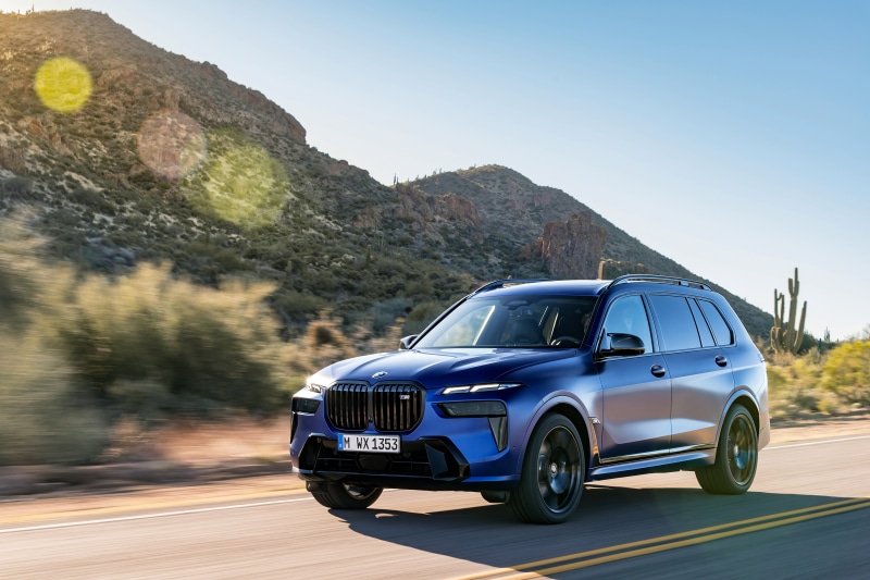 BMW X7 M60i xDrive driving on a desert road