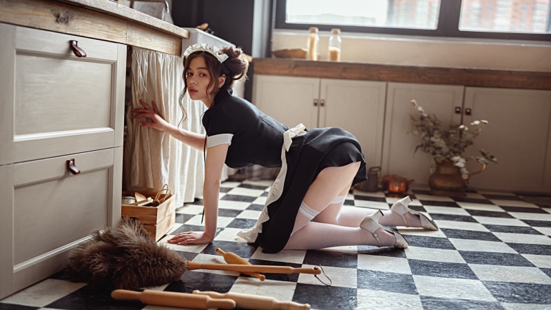 Maid Maya Shakhnazarova posing in a kitchen