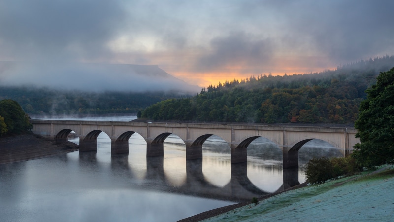 Bridge over Ladybower Reservoir in England with fog