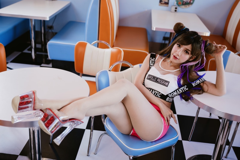 Asian woman in retro diner setting