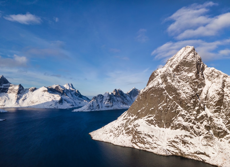 Snow-covered mountains and a fjord in Norway