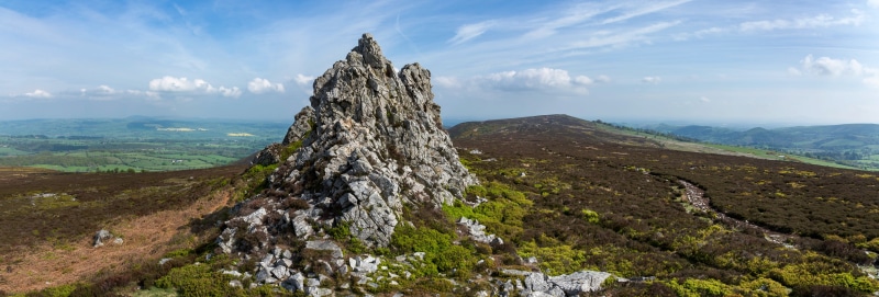 Rocky outcrop on a heather-covered hill in Shropshire, England