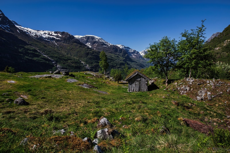 Small wooden hut in Sogn og Fjordane, Norway with mountains