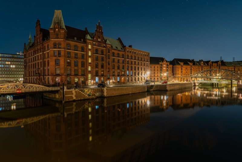 Hamburg Speicherstadt at Night with River and Bridges