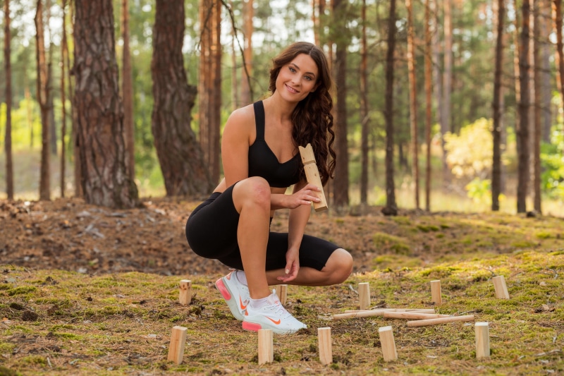 Mara Blake fitness pose in forest