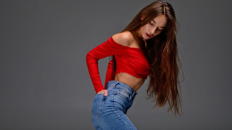 Gloria Sol in red top and jeans