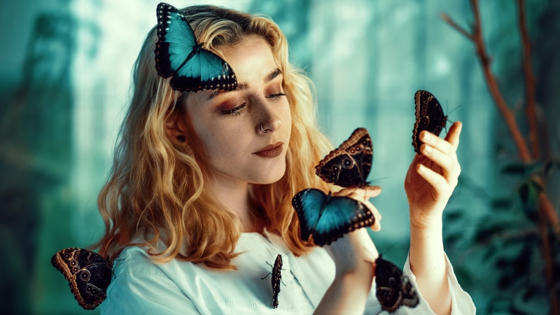 Blonde girl with butterflies on her body