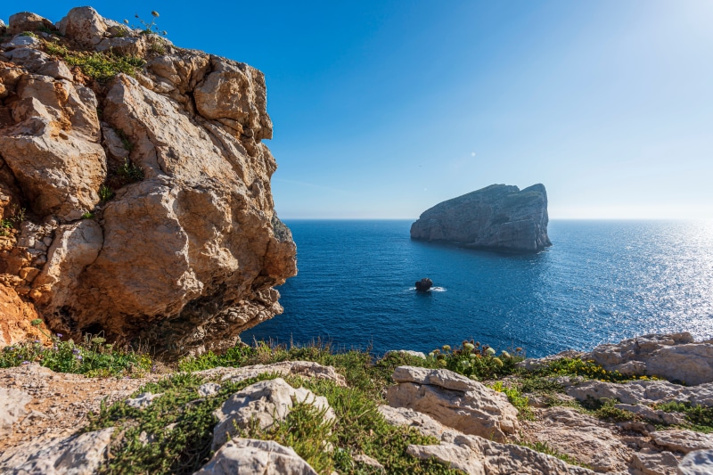 Rocky coast and sea stacks in Alghero, Italy