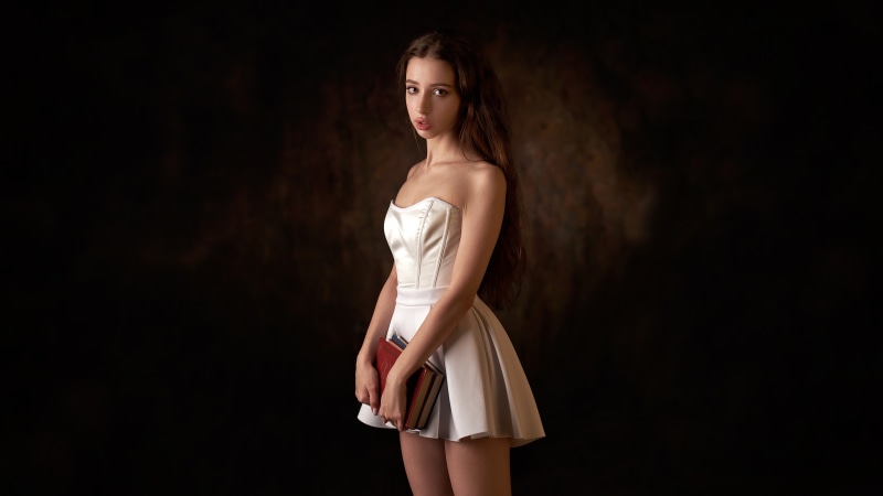 Brunette girl holding books