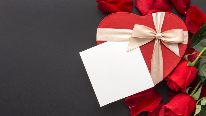 Heart-shaped gift box with roses and blank card