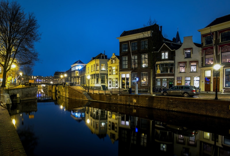 Houses and river at night in Schiedam, Netherlands