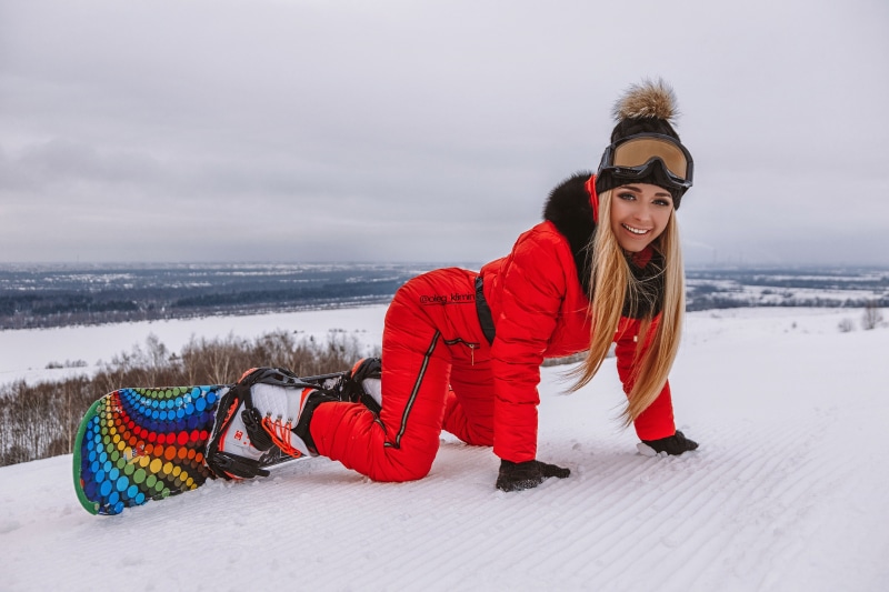 Anastasia Zakharova snowboarding in winter