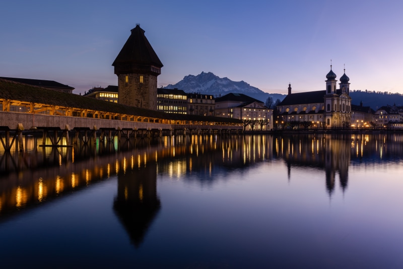 Chapel Bridge and Water Tower in Lucerne, Switzerland at Dusk