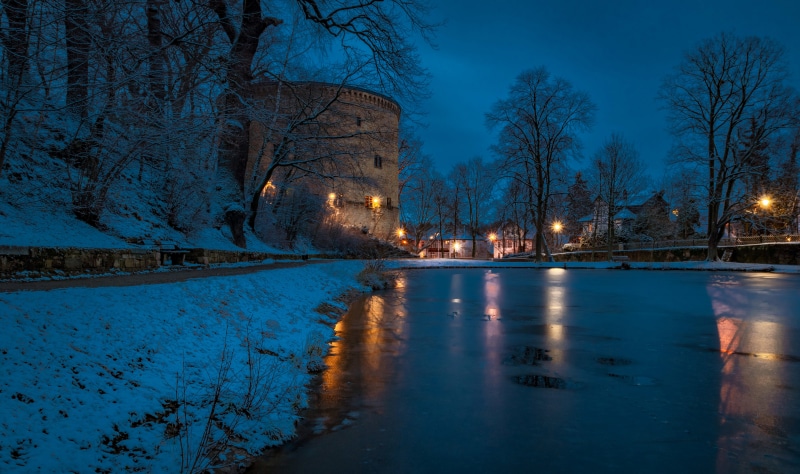 Tower by frozen lake in Goslar, Germany during winter
