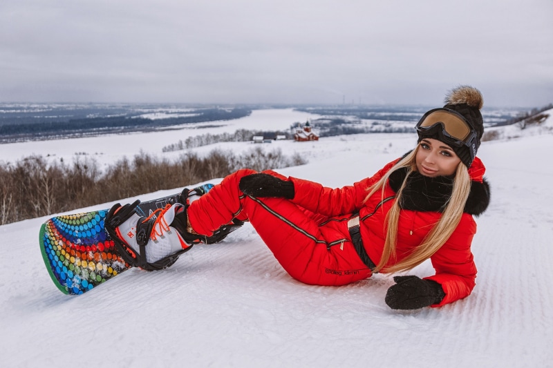 Anastasia Zakharova snowboarding in winter