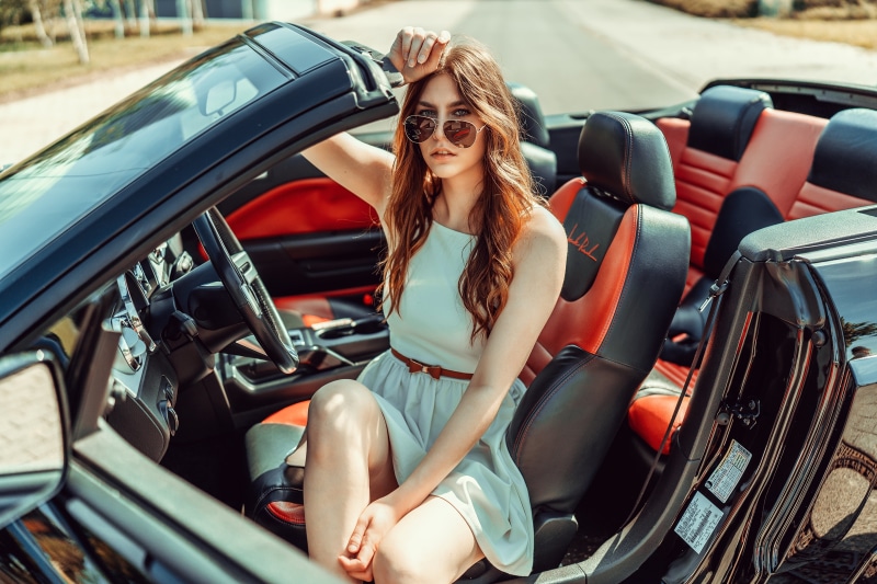 Beatrice Rogall in a convertible car