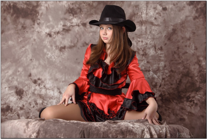 Kleofia model wearing a cowboy hat and red outfit