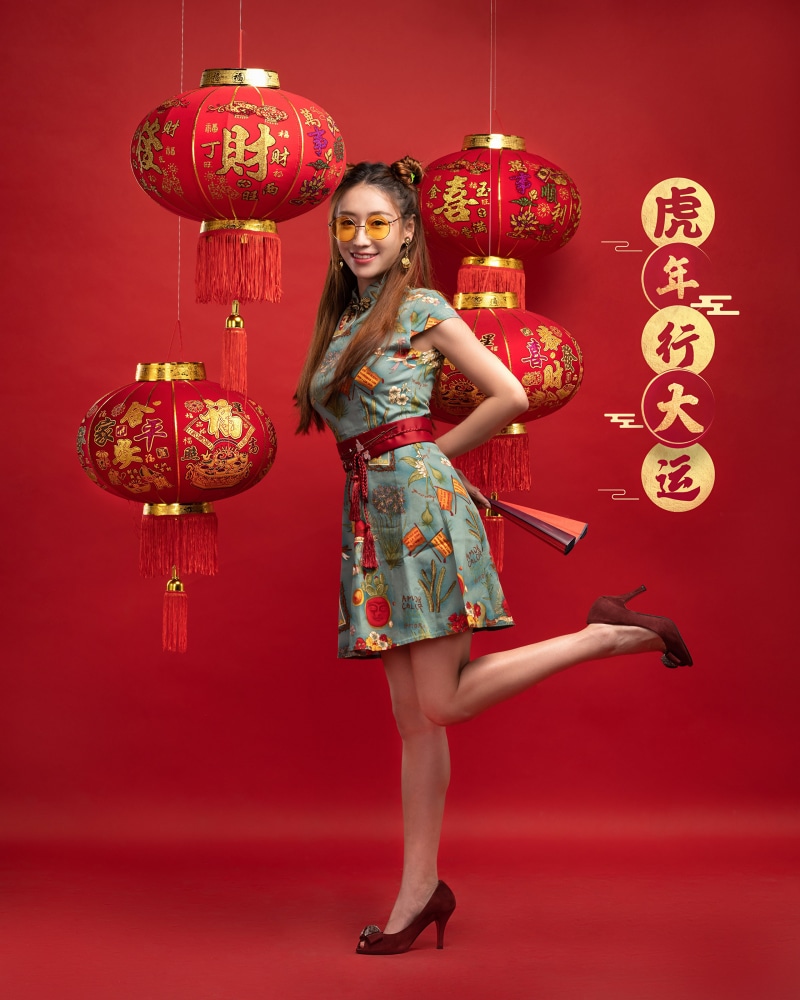 Woman in Cheongsam Dress Posing with Chinese Lanterns