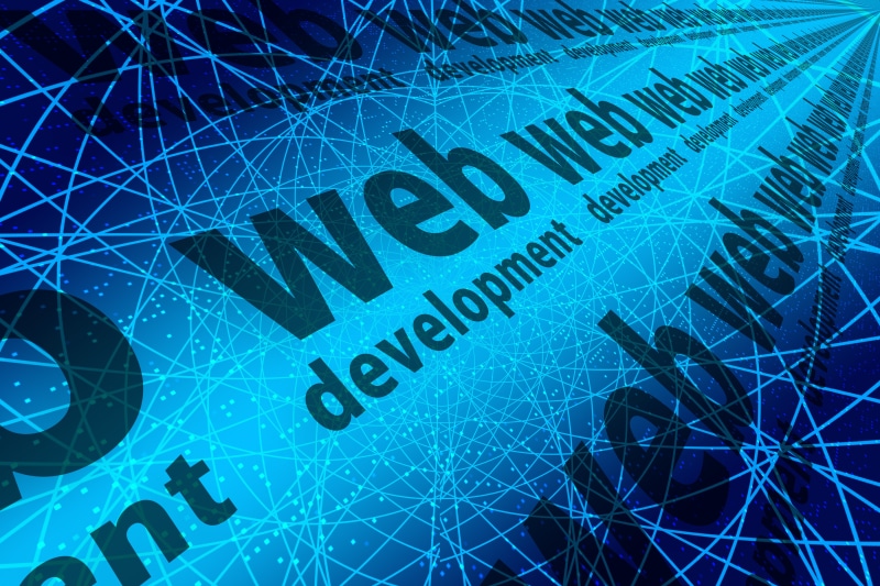 Web development text on a blue network background