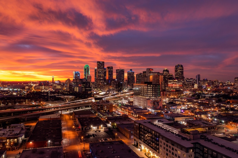 Dallas skyline at sunset with dramatic clouds