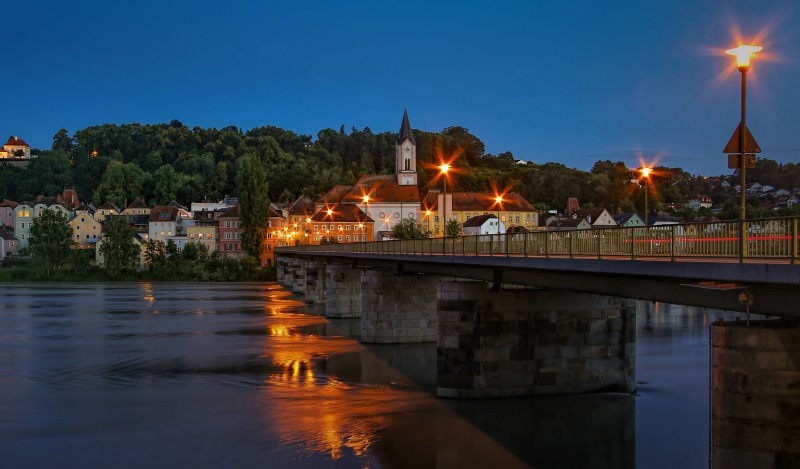 Bridge over a river in Passau, Germany at dusk