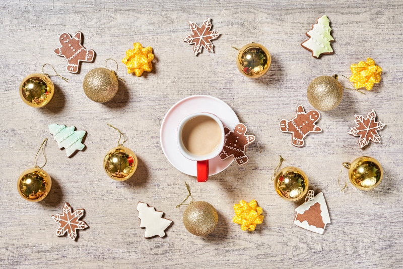 Christmas cookies and coffee on wooden background