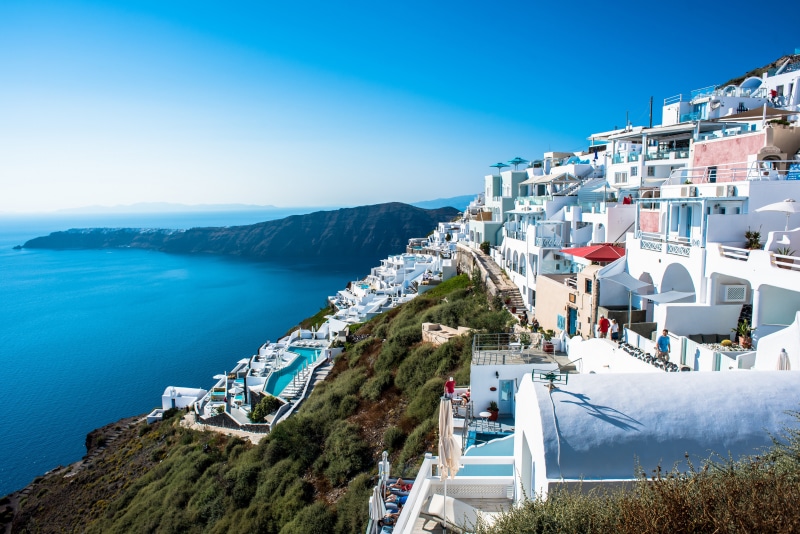 Oia, Greece Coastline with White Houses and Blue Sea