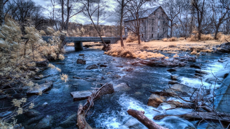Stone Mill and Bridge over a River in Pennsylvania