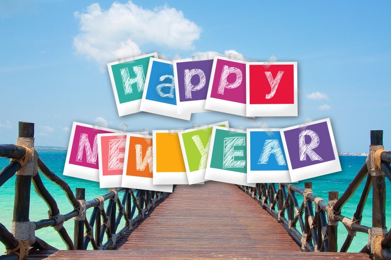 Happy New Year on a Tropical Beach Boardwalk