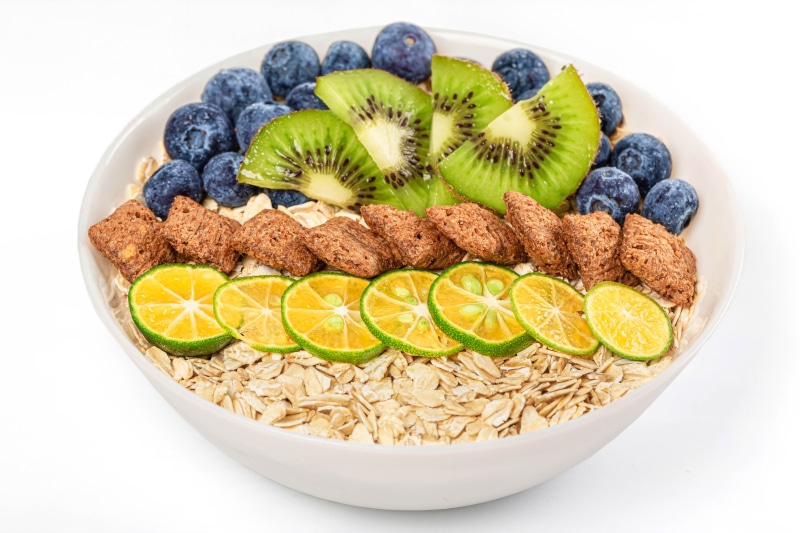 Oatmeal with blueberries, kiwi, lime, and cereal