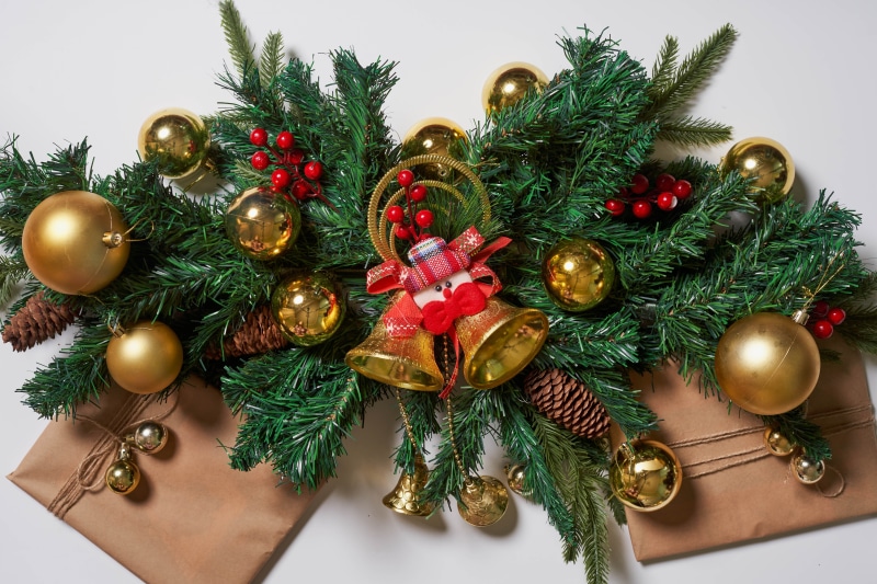Christmas garland with ornaments and gifts