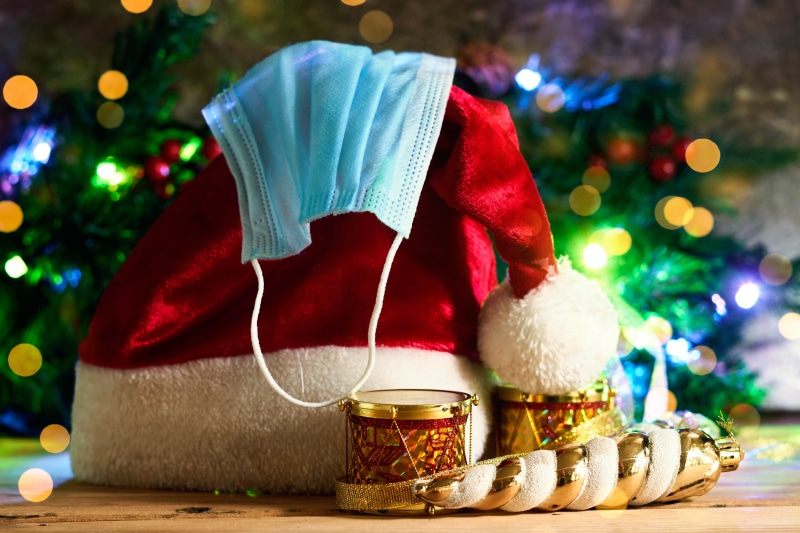 Santa hat with face mask and Christmas decorations